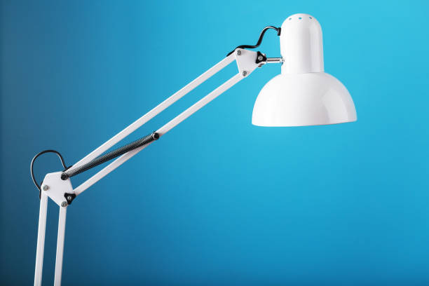 istock Office table lamp on blue background with space for text and idea concept 1445488053