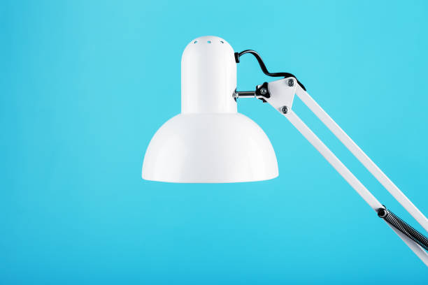 istock Office table lamp on blue background with space for text and idea concept 1445488752