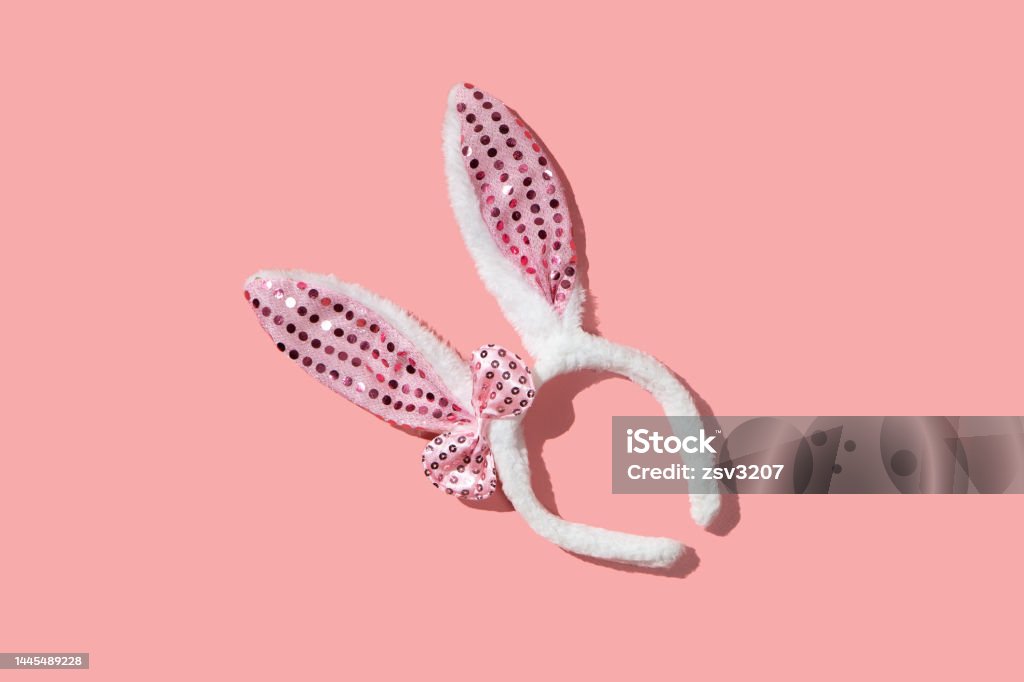 Bunny ear bezel on a pink background flat lay Bunny ear bezel on a pink background flat lay mockup Backgrounds Stock Photo