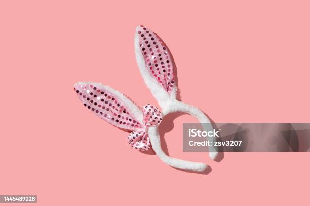Bunny Ear Bezel On A Pink Background Flat Lay Stock Photo - Download Image Now - Backgrounds, Color Image, Copy Space