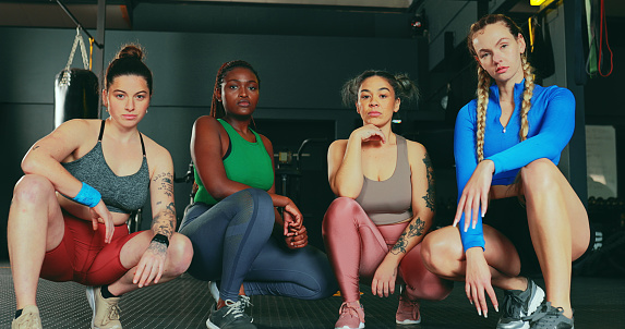 Fitness, portrait and strong group of women after a workout exercise in the gym for strength and stamina. Female friends,  training and healthclub with people ready for sporty pose in sportswear