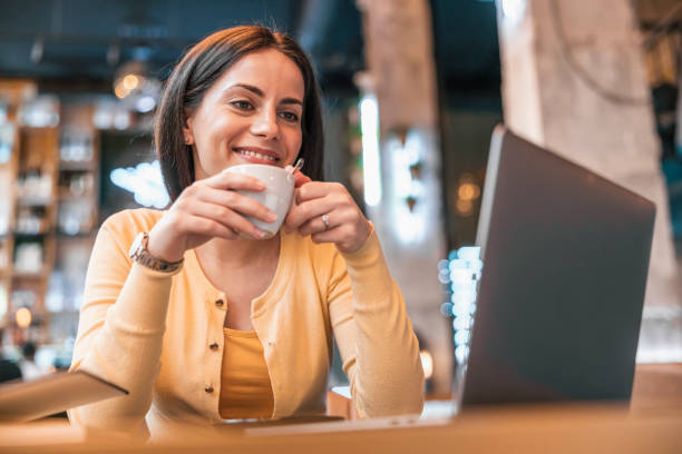 istock Woman using laptop in cafe 1445498491