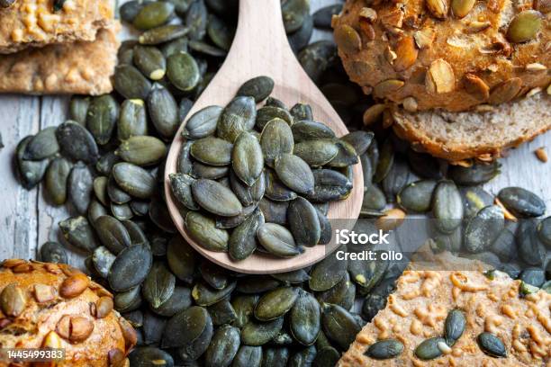 Pumpkin Seed And Bread Stock Photo - Download Image Now - Bowl, Pumpkin Seed, Baked