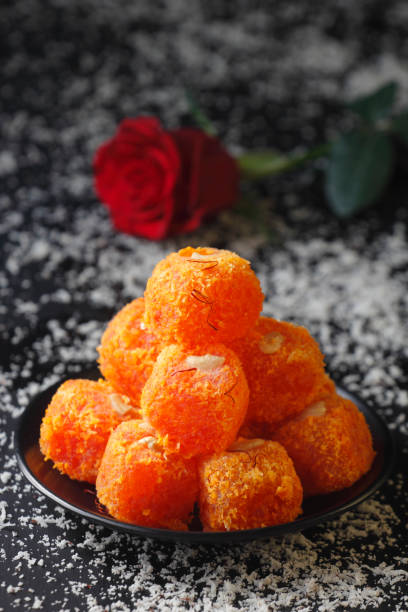 Gulab Petha Ladoo Petha is world famous sweet of Agra, India. Traditionally it is made from Ash Gourd and dipped in sucrose. mithai stock pictures, royalty-free photos & images