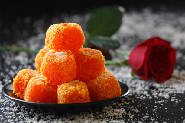 Gulab Petha Ladoo Petha is world famous sweet of Agra, India. Traditionally it is made from Ash Gourd and dipped in sucrose. india sweets stock pictures, royalty-free photos & images