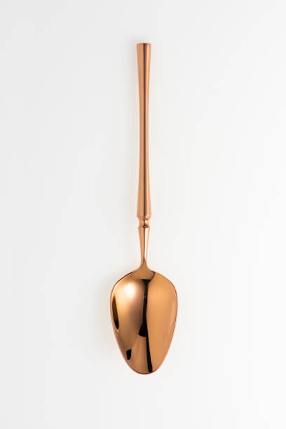 istock Golden spoon isolated on white background. Studio shot. 1445503764