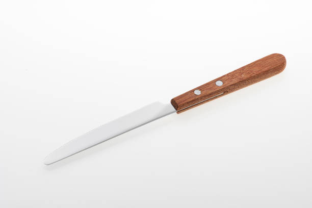 istock Wooden silver knife isolated on white background. Studio shot. 1445504776