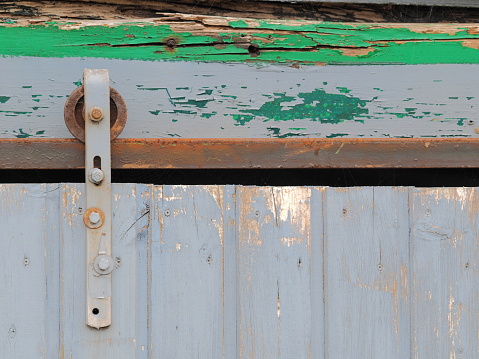 Weathered rustic old sliding gate details