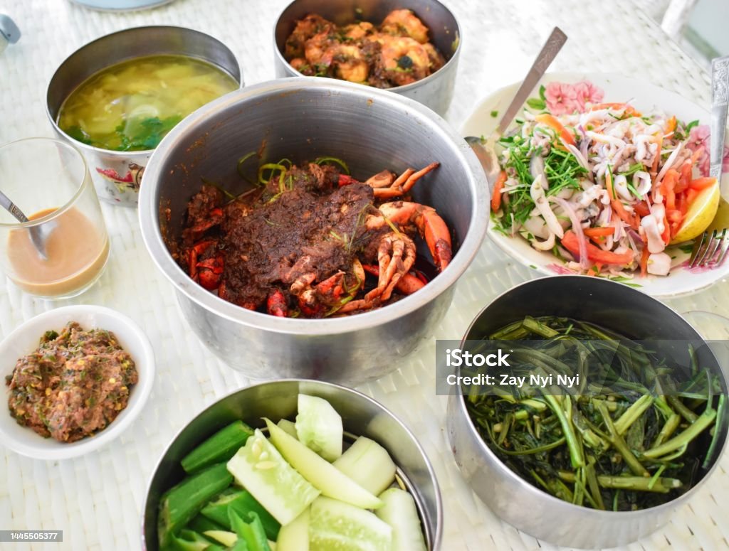 Myanmar seafood curry recipes in Chaugtha beach. Delicious menu. Myanmar traditional seafood curry recipes in Chaugtha beach. Delicious menu. Beach Stock Photo
