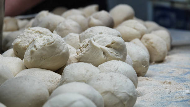 istock Prepared dough balls for restaurant baking. Pizza, pita, dough balls 1445507575