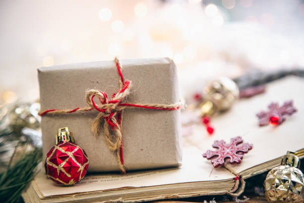 istock Craft gift box and Christmas decor details on a blurred background. 1445509214