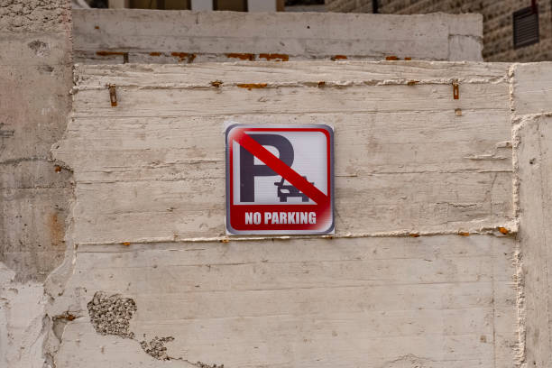 istock a square parking sign is prohibited on a concrete wall. Tools for regulating traffic and parking regulations. 1445509858
