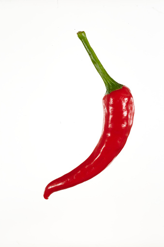 Fresh hot chili pepper on white background. Red color.