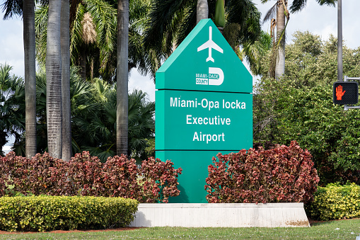 Opa Locka, FL, USA - January 2, 2022: Miami Opa Locka Executive Airport sign is shown in Opa Locka, FL, USA. Miami-Opa Locka Executive Airport is a joint civil-military airport.