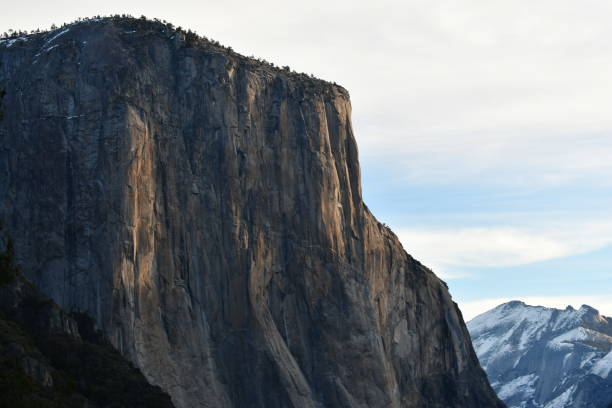 istock El Capitan in Early Morning Light with Snow Covered Peaks 1445513463