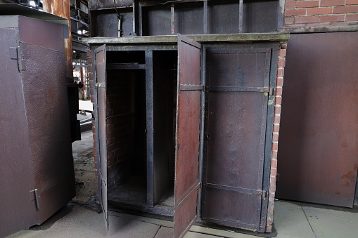 an old rusty open metal cupboard