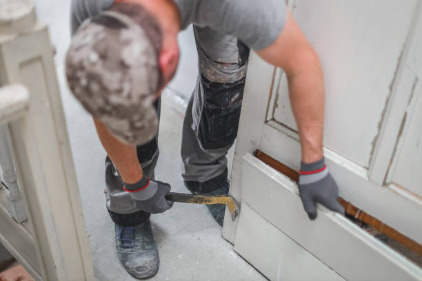 istock A young man works with a crowbar. 1445513695