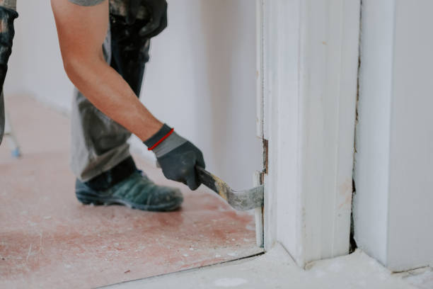 istock Hands of a young man working with a crowbar. 1445513697