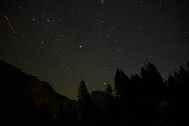 istock Stars with Forest and Satellite Trail 1445515294