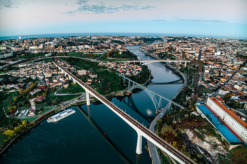 Porto, Portugal. Aerial view of the old city and promenade of the Douro river. View of the city and bridges over the river