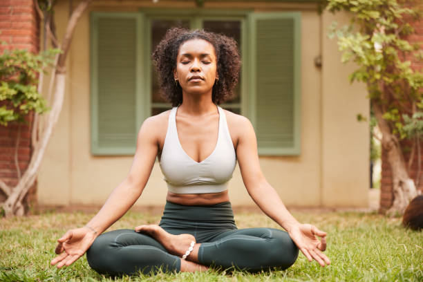 istock Starting the day in her garden in meditation 1445516651