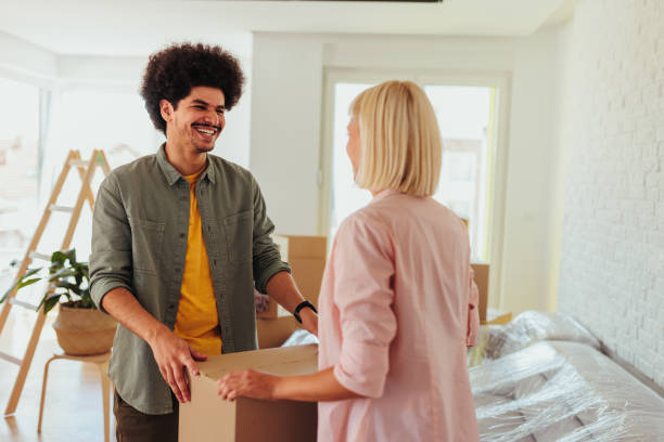 istock Joyful couple moving in new home. 1445517211