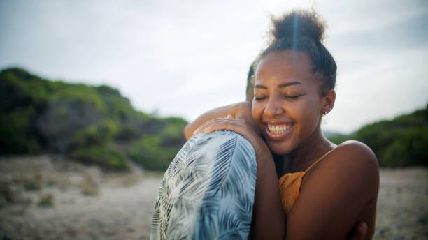 istock Loving african ethnicity couple playfully embracing on beach. 1445522730