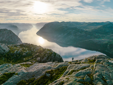 Aerial view of woman hiking on the background of Lysefjord