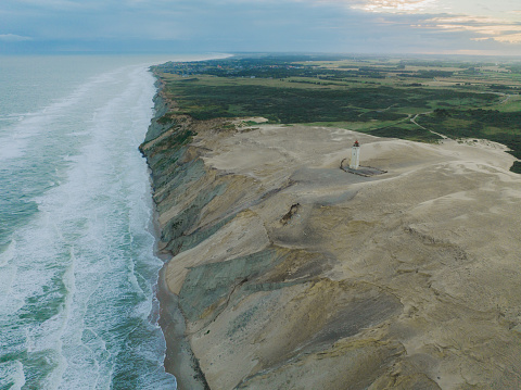 Scenic aerial view of abandoned Rubjerg Knude lighthouse in Denmark