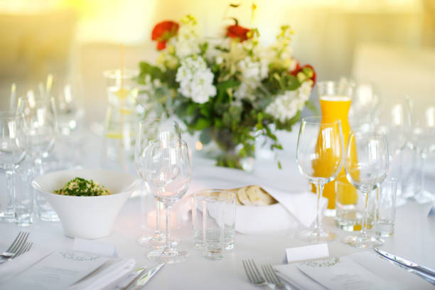 istock Beautiful table setting with crockery and flowers for a party, wedding reception or other festive event 1445528527