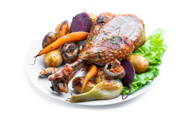 istock Oven roasted turkey and vegetables with spices and herbs isolated on white 1445530682