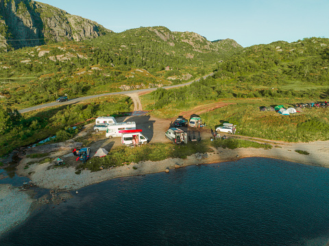 Aerial view of campers in camping near the lake in Norway at sunset