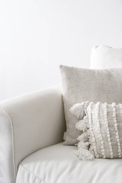 istock White and clean couch with decorative cushions 1445531585