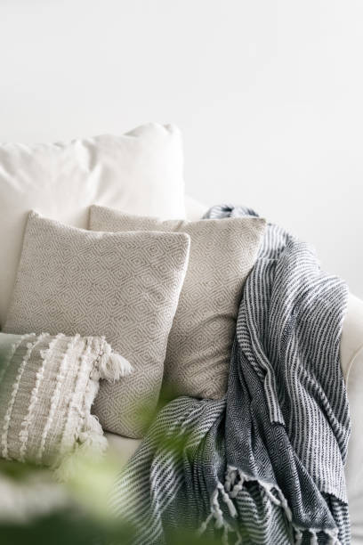 istock Decorative cushions in white pillowcases at sofa 1445531625