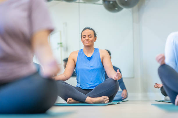 istock Adults in the Lotus Position 1445533055
