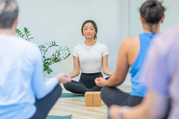 istock Adults in the Lotus Position 1445533260