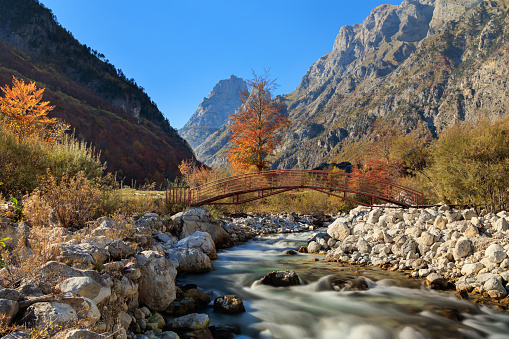 Valbona River bridge in Albanian Alps in Autumn
