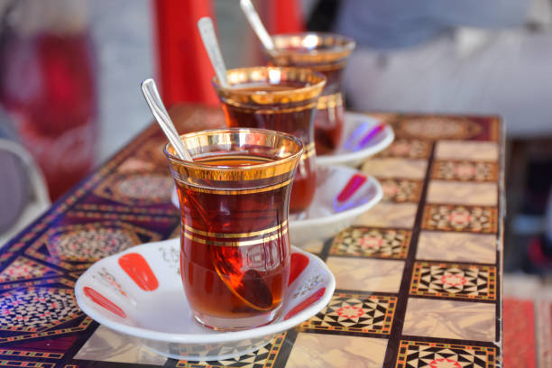 istock three tea glasses of traditional turkish tea and spoon on backgammon table 1445545620