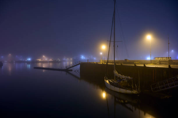 Boat moored in port at night in Reykjavík, Iceland
