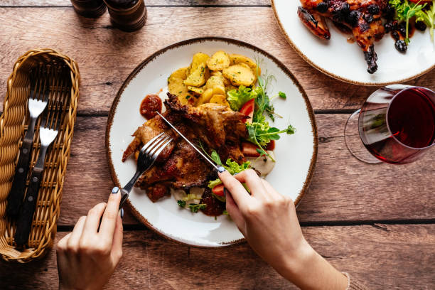 istock grilled quail with sauce served on a plate with vegetables and h 1445546441