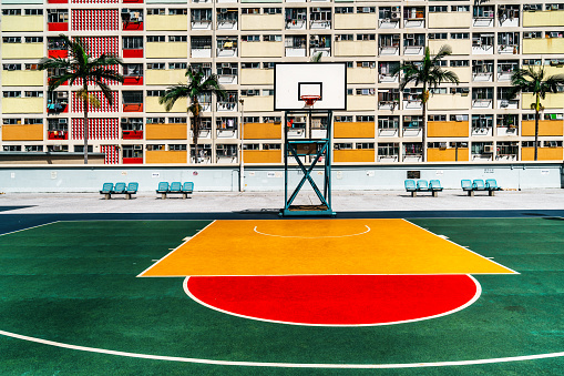 Colorful basketball court and buildings in Hong Kong residential district