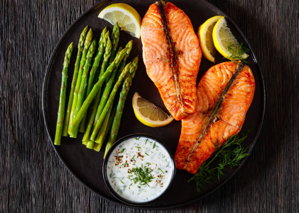 istock roast salmon steaks with asparagus and dill sauce 1445549849