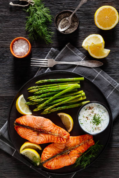 istock roast salmon steaks with asparagus and dill sauce 1445550486
