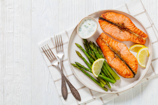 istock roast salmon steaks with asparagus and dill sauce 1445550514