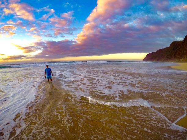 istock Sunset in the waves at Polihale beach 1445552217