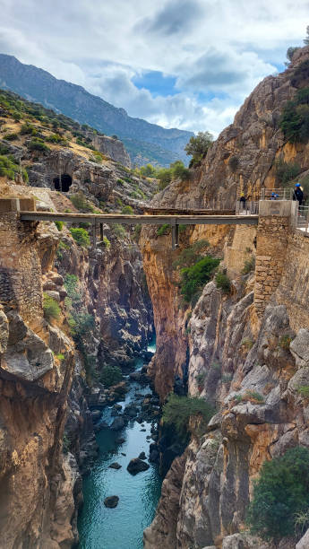 Caminito Del Rey, Spain, November 25, 2022: Bridge in Gorge of the Gaitanes in El Caminito Del Rey ,the Kings Little Path. A Walkway, Pinned Along the Steep Walls of a Narrow Gorge in El Chorro, Near Ardales in the Province of Malaga, Spain puente en el desfiladero de los gaitanes en el caminito del rey ,el pequeño camino de reyes. una pasarela, clavada a lo largo de las empinadas paredes de un estrecho desfiladero en el chorro, cerca de ardales en la provincia de málaga, españa