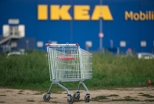 Bucharest, Romania - October 07, 2022: A supermarket shopping cart is seen in front of IKEA Bucharest Baneasa store, in northern Bucharest, Romania.