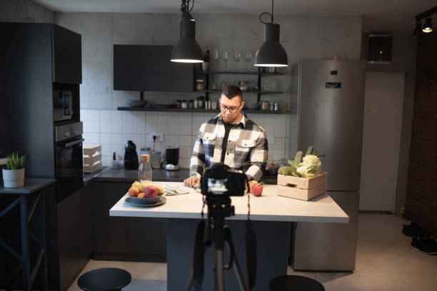 istock Recording a video at home, while preparing food in the kitchen 1445558690