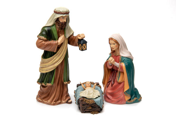 istock Isolated on White Old figurines representing a Nativity scene (the holy family) 1445560026