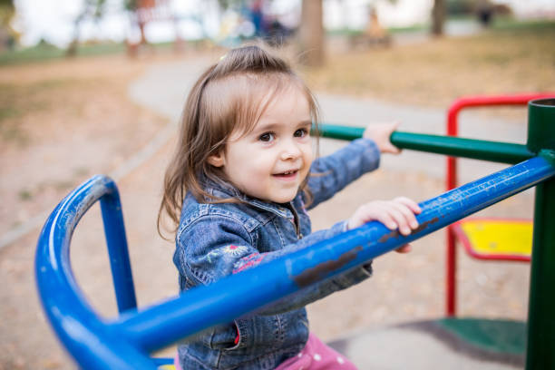 istock Young Girl Playing in a Public Playground 1445563033